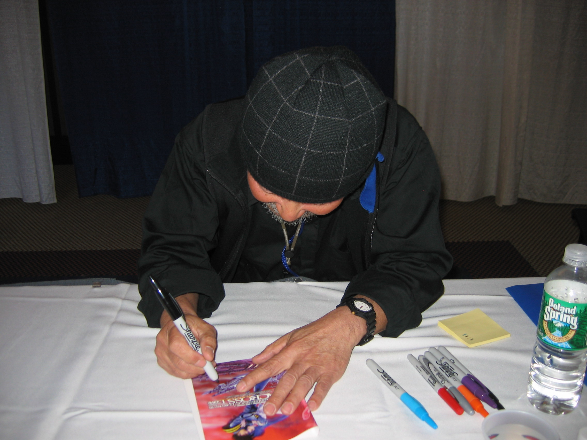 Iwata Hiroshi signs the Japanese R2 DVD cover for Macross: Do You Remember Love?